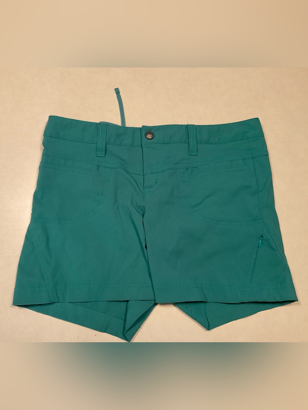 teal-green Athleta Dipper athletic hiking shorts